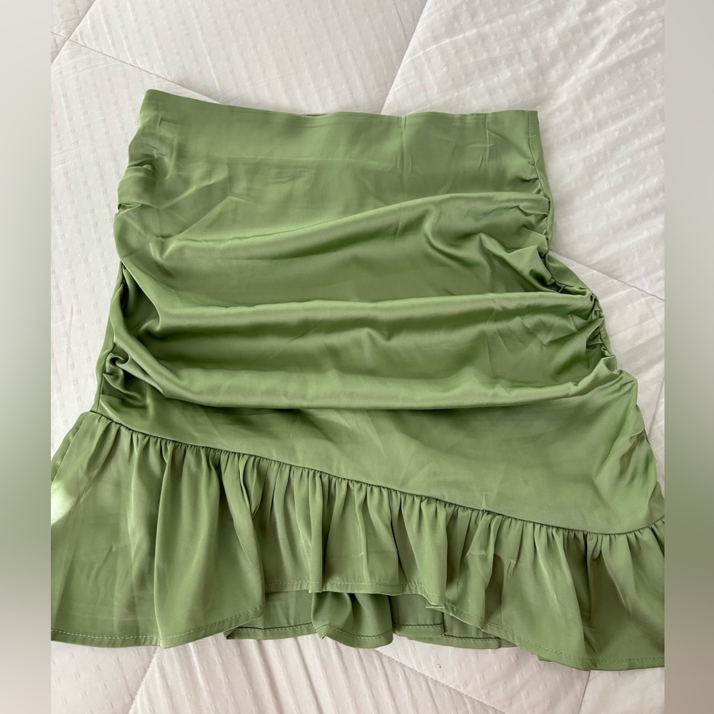 Rouched green skirt satin
